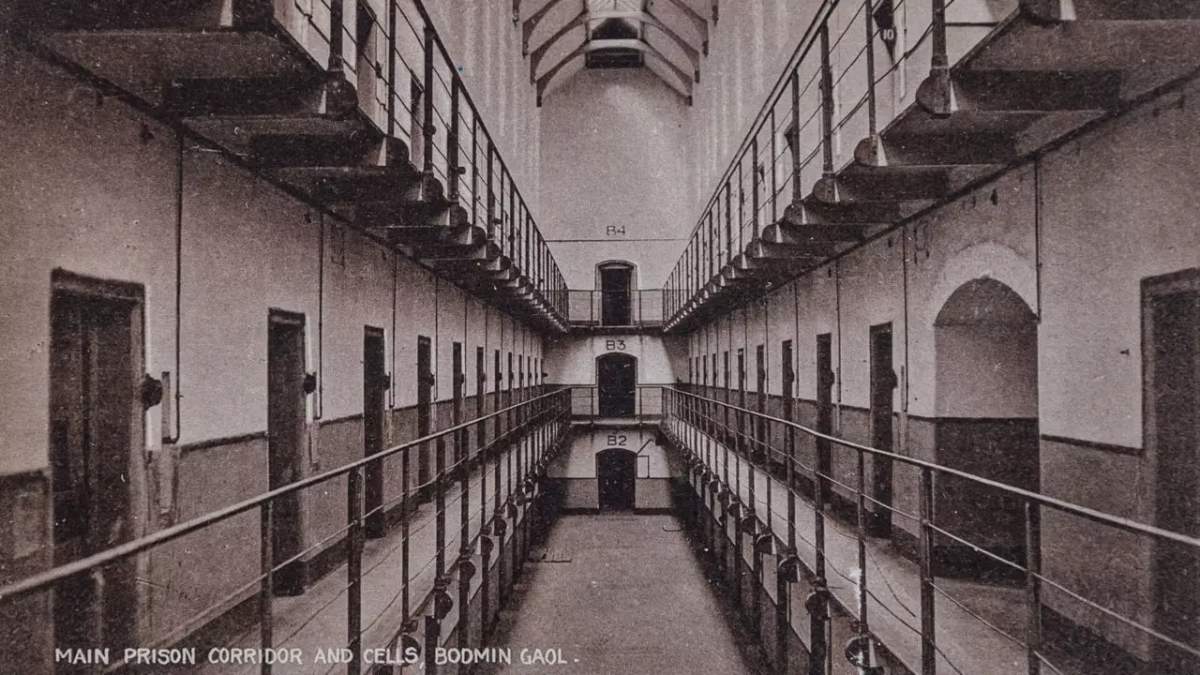 Old photo of main prison corridor and cells