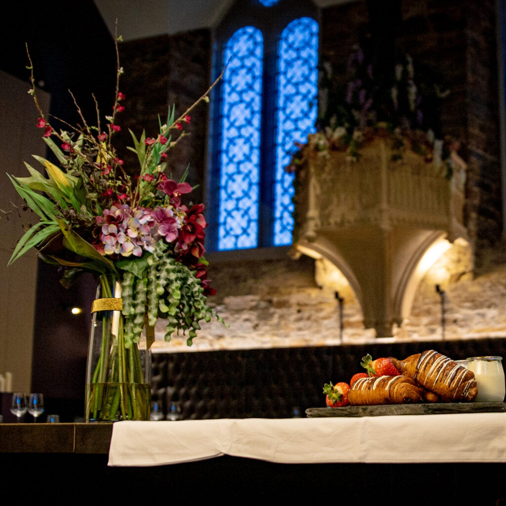 Hearty breakfast spread at Bodmin Jail Hotel, featuring a variety of freshly baked pastries, hot dishes, and locally sourced ingredients, served in a historic dining room.