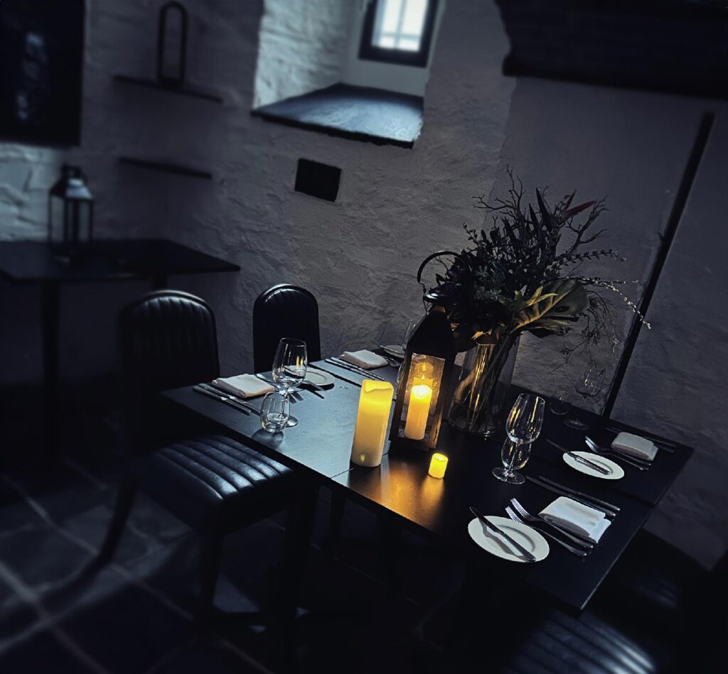 photo of a table set for dinner at the condemned cell