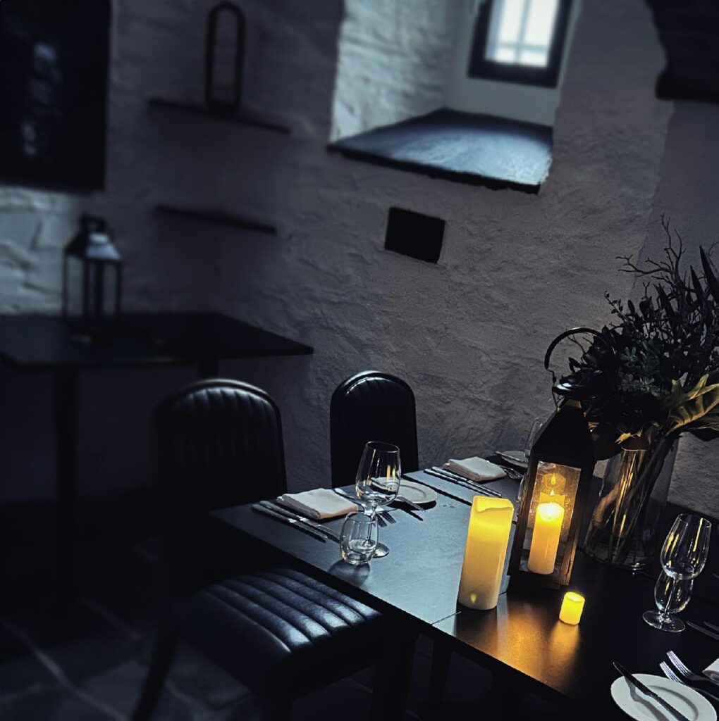 photo pf a table set for dinner at the condemned cell